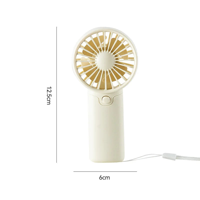🌬️ Mini ventilateur de poche à piles – Léger, puissant et idéal pour rester au frais partout ! ☀️